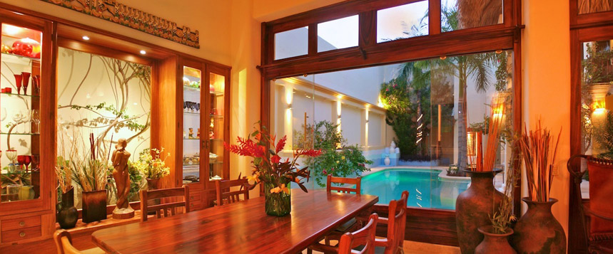 Villa pool and courtyard in the sunshine.